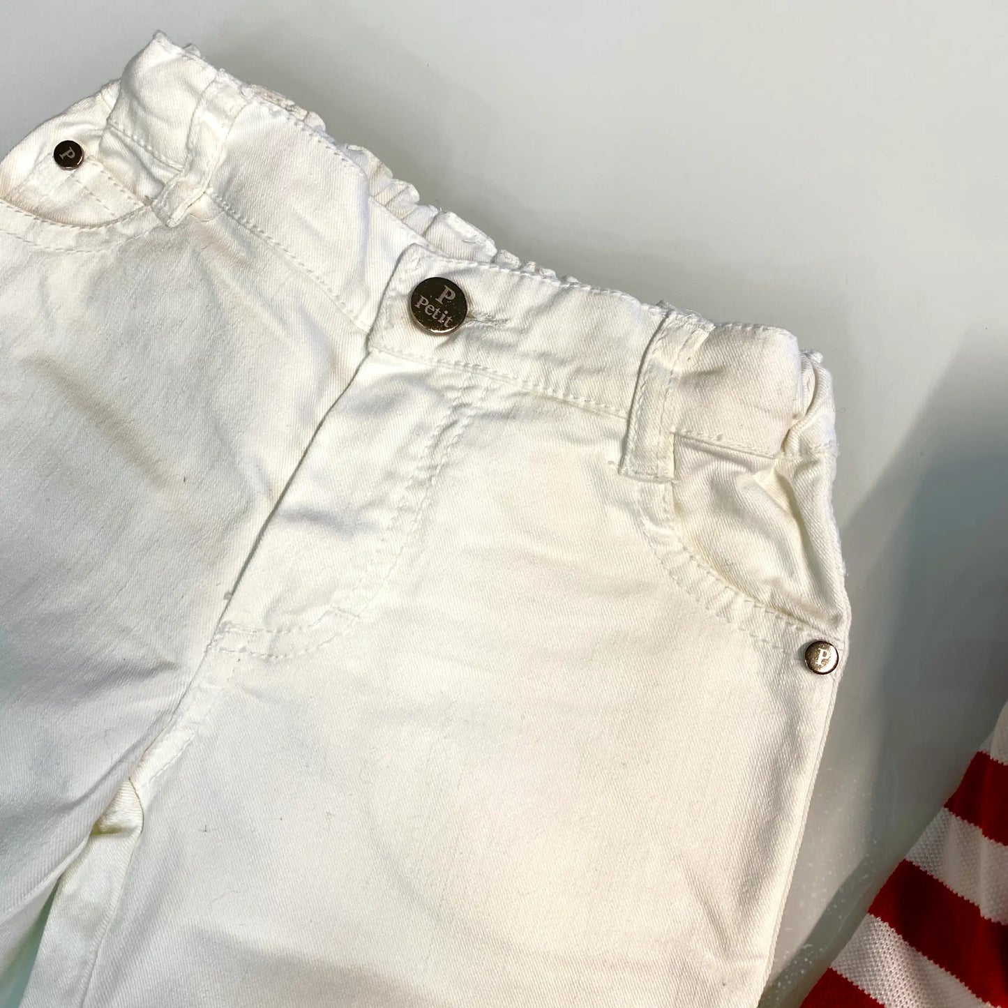 Jeans in cotone bianco per neonato