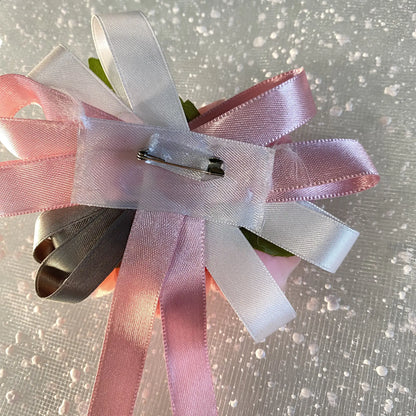 Spilla bouquet rosa per abiti da cerimonia bambina