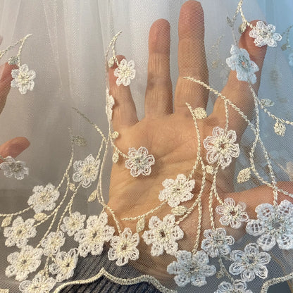 Abito neonata panna e oro con gonna in tulle a fiori