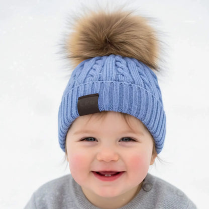 Berretto turchese con pompon per bambino in Outlet