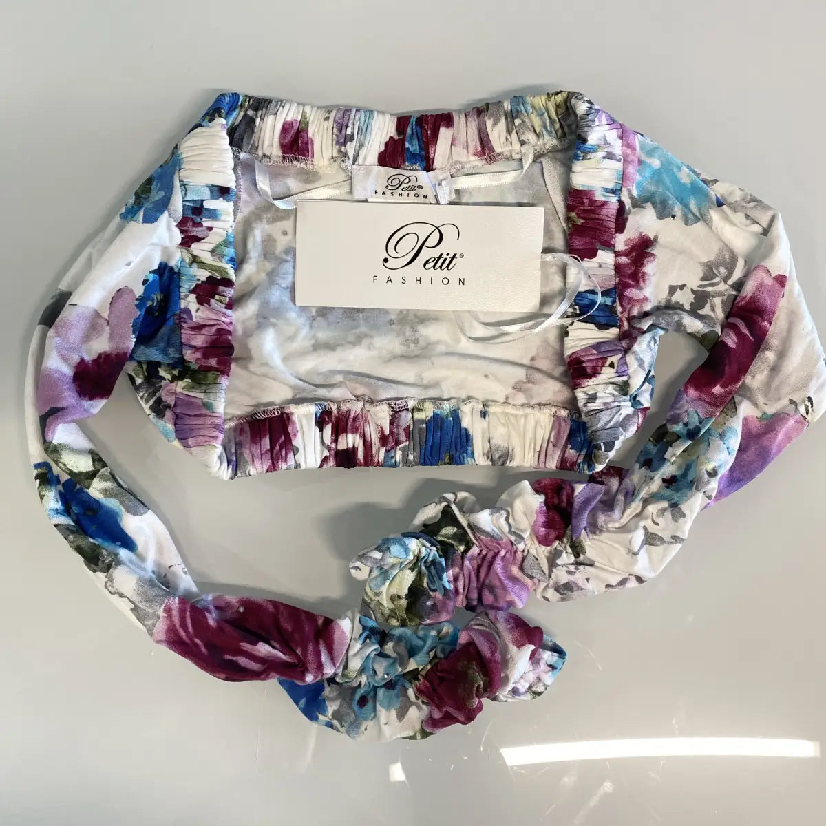 Coprispalle elegante fantasia a fiori Petit per bambina