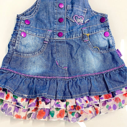 Salopette in jeans con balze floreali