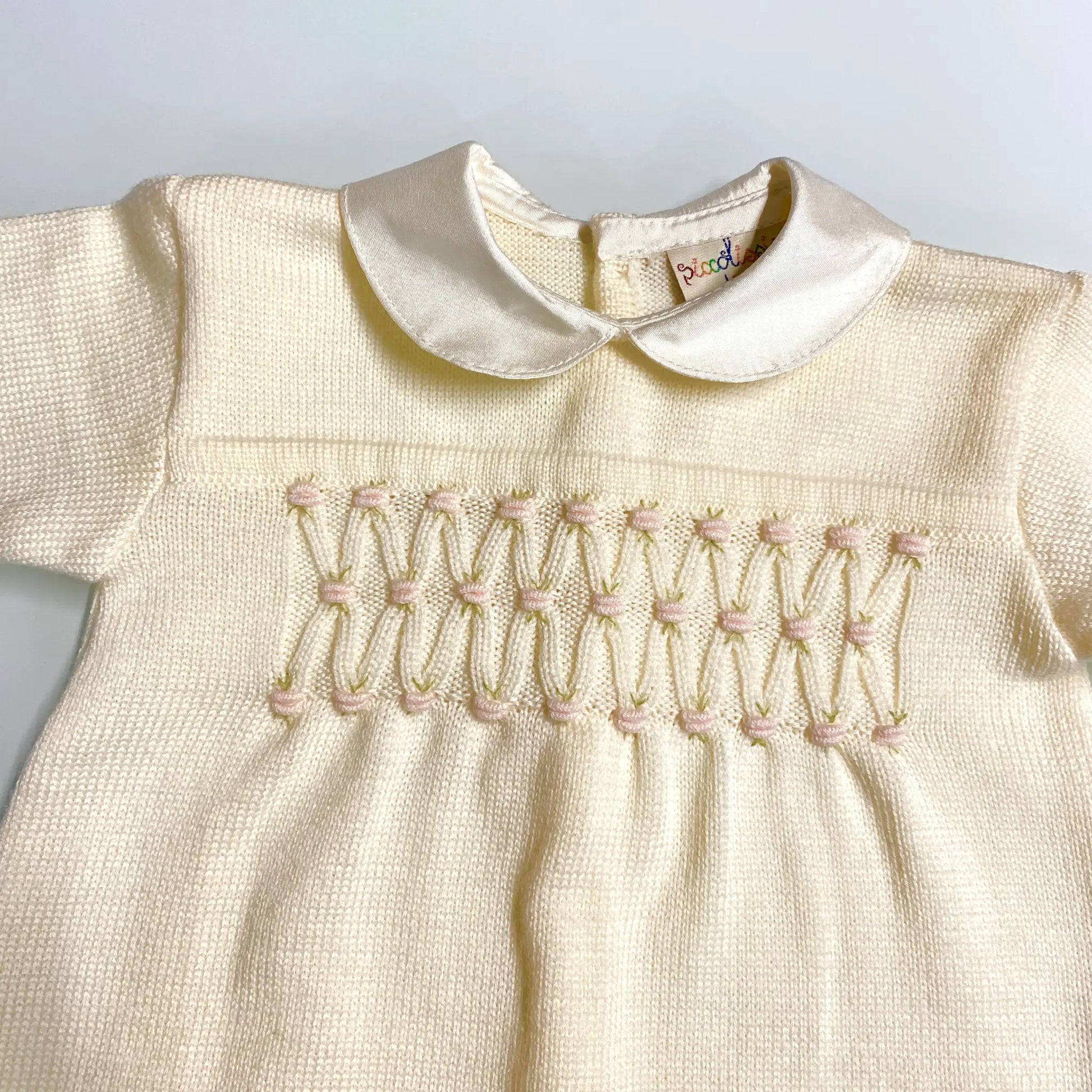 Tutina in pura lana a punto smock per neonata